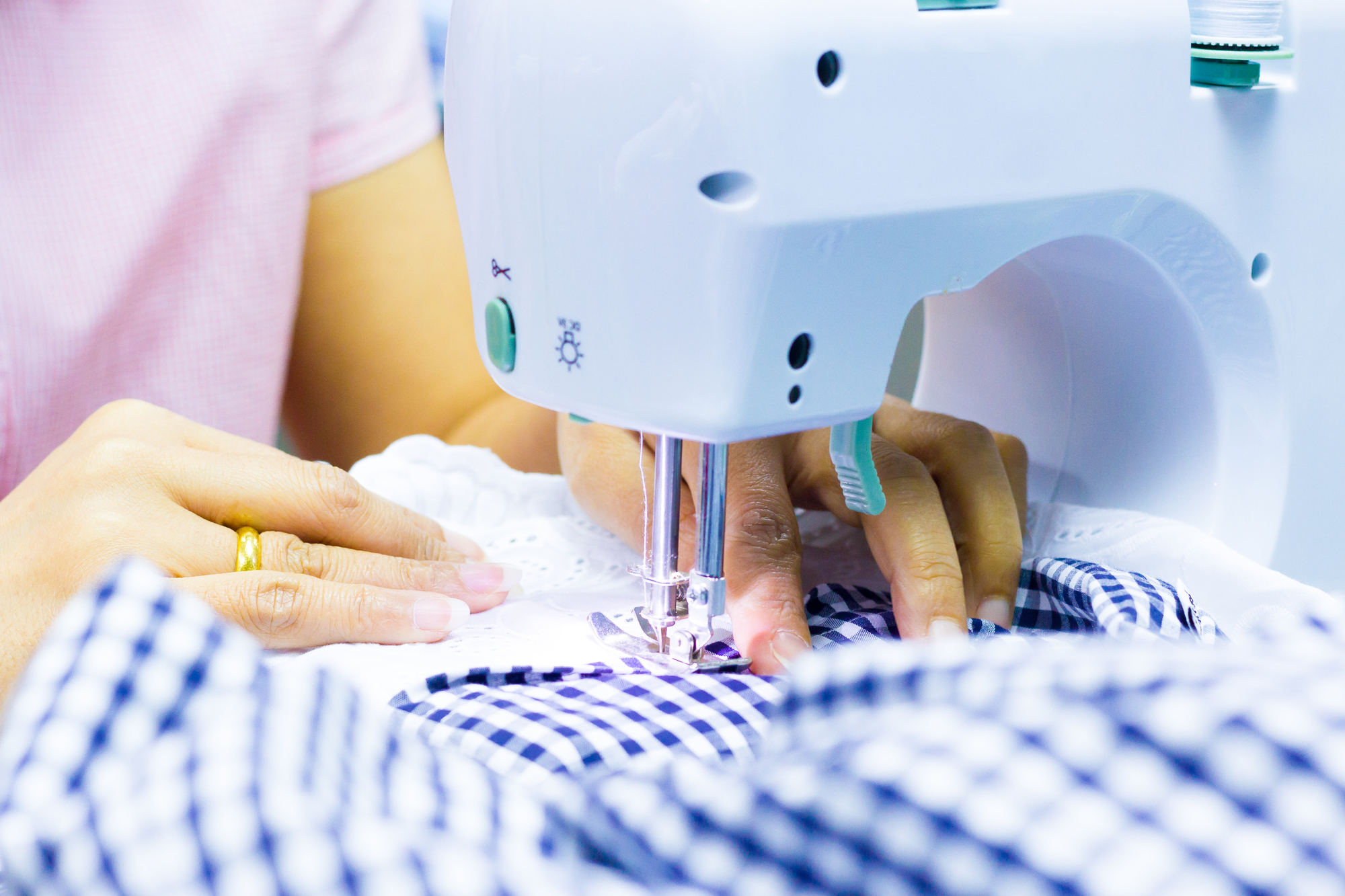 woman working on a portable sewing machine