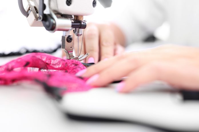 woman sewing on her starter sewing machine