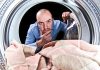Washing Symbols and What Do They Mean man thinking about washing symbols and their compatibility with the machine