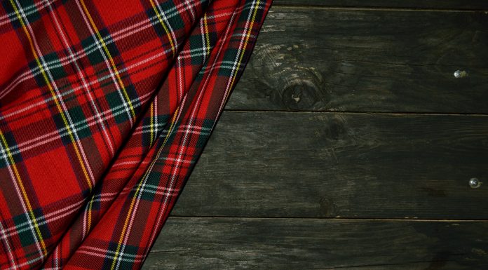 tartan for kilt on a wooden background