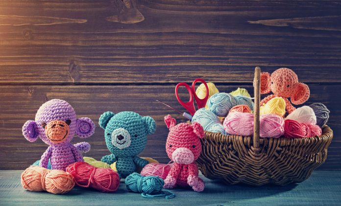 Amigurumi toy animals next to a basket