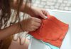 girl sewing by hand a piece of fabric